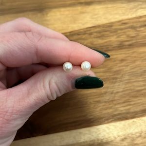 White pearl earrings with gold posts